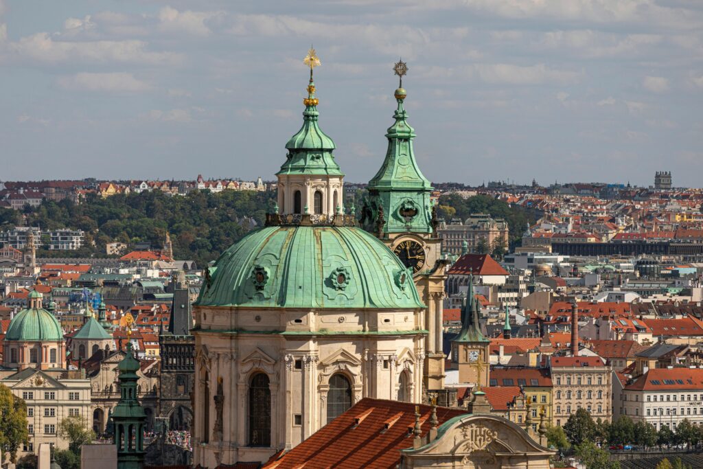 Beautiful aerial shot of St. Nicholas Church with cityscape in Prague, Czech Republic.