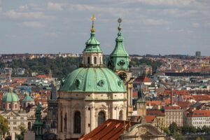Beautiful aerial shot of St. Nicholas Church with cityscape in Prague, Czech Republic.